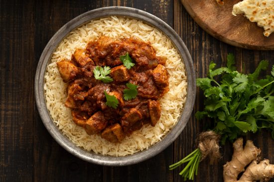 Chicken Vindaloo is a fiery and tangy dish from Goan cuisine, heavily influenced by Portuguese flavors. It's known for its spicy and slightly vinegary taste, made with a blend of aromatic spices and marinated chicken.