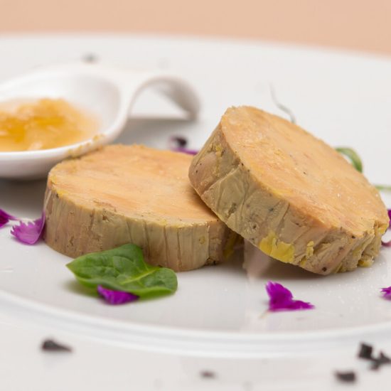 Foie Gras au Torchon is a luxurious French delicacy where foie gras is marinated, rolled in a cloth (torchon means 'kitchen towel' in French), and then poached to perfection.