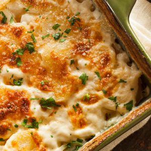 Gratin Dauphinois is a classic French dish, originating from the Dauphiné region. It features thinly sliced potatoes baked in a creamy garlic-infused sauce, topped with a golden, crusty cheese layer.