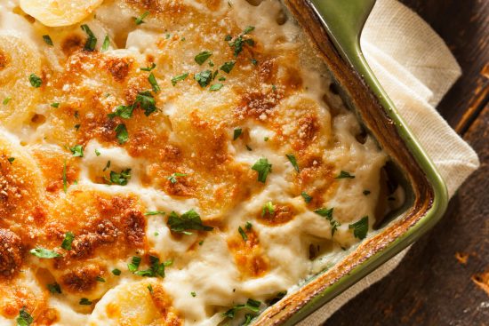 Gratin Dauphinois is a classic French dish, originating from the Dauphiné region. It features thinly sliced potatoes baked in a creamy garlic-infused sauce, topped with a golden, crusty cheese layer.