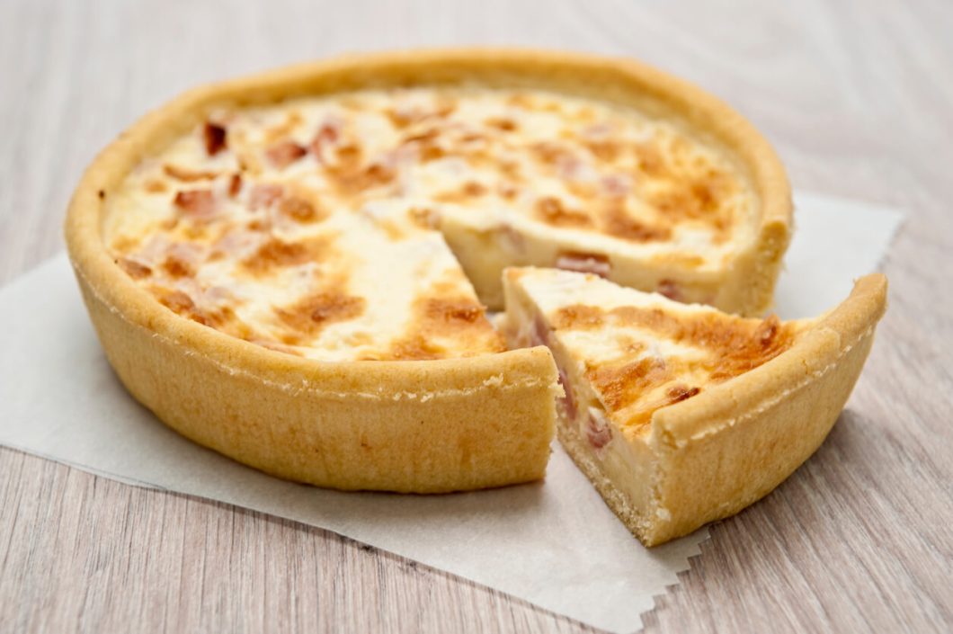 Tarte à l'Oignon, or Onion Tart, is a classic French dish featuring a delicious combination of caramelized onions, creamy custard, and a flaky pastry crust.