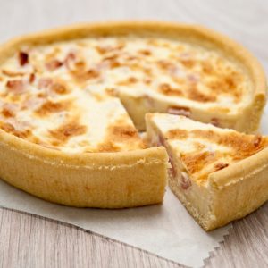 Tarte à l'Oignon, or Onion Tart, is a classic French dish featuring a delicious combination of caramelized onions, creamy custard, and a flaky pastry crust.