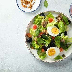 Salade Niçoise is a vibrant and nutritious dish from the French Riviera. The traditional version often includes anchovies, but this variation omits them, catering to those who prefer their salad without.