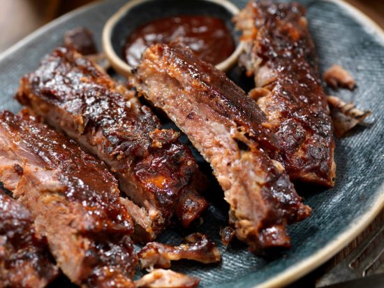 Barbecue Ribs are a quintessential American dish, loved for their tender, fall-off-the-bone meat and smoky, sweet, and tangy barbecue sauce.