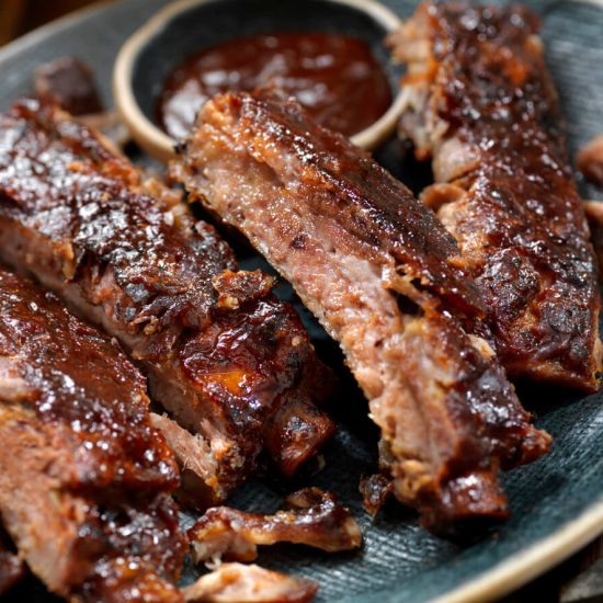 Barbecue Ribs are a quintessential American dish, loved for their tender, fall-off-the-bone meat and smoky, sweet, and tangy barbecue sauce.