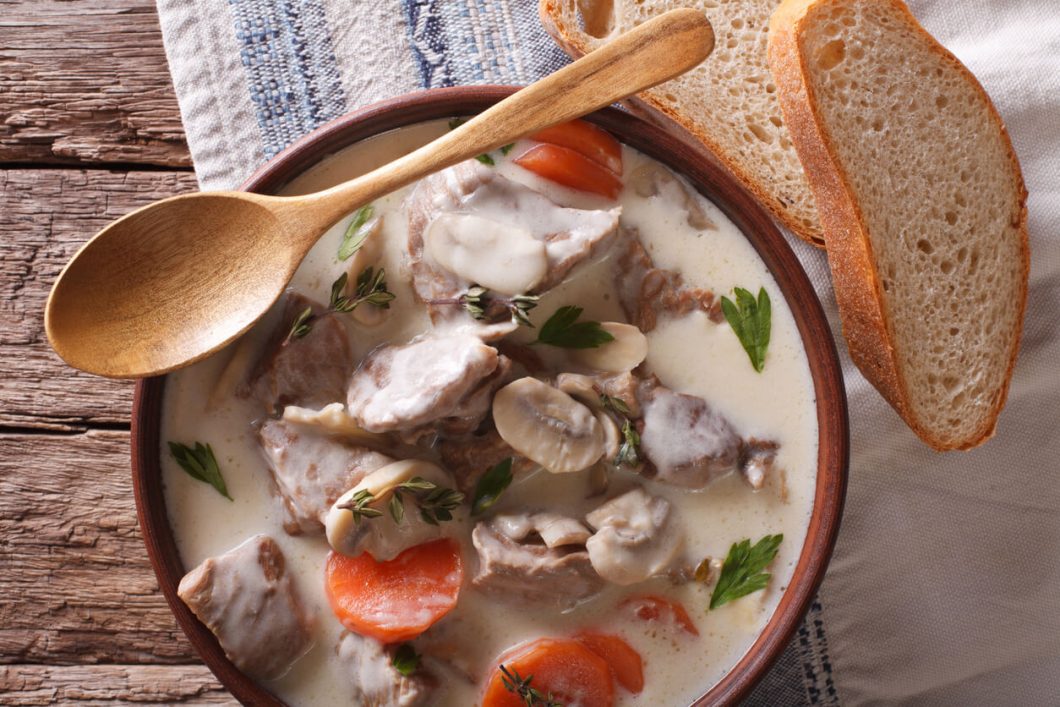 Blanquette de Veau is a classic French stew made from veal, mushrooms, and onions, simmered in a white, creamy sauce.