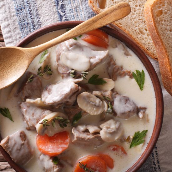 Blanquette de Veau is a classic French stew made from veal, mushrooms, and onions, simmered in a white, creamy sauce.