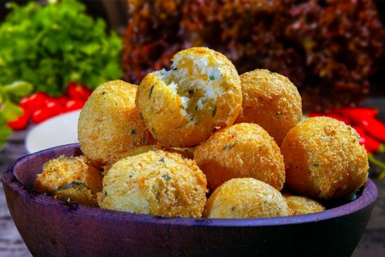 Bolinho de Bacalhau is an ideal choice for those who appreciate seafood and enjoy flavorful, bite-sized snacks. These codfish cakes offer a taste of Portuguese culinary influence in Brazilian cuisine and are sure to be a hit at any party or as a tasty appetizer before dinner.