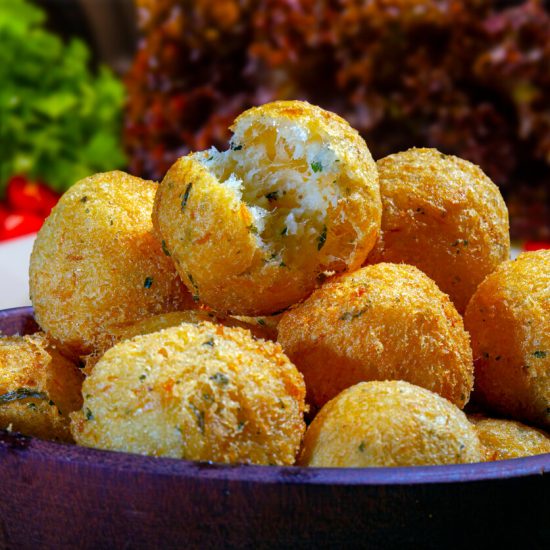 Bolinho de Bacalhau is an ideal choice for those who appreciate seafood and enjoy flavorful, bite-sized snacks. These codfish cakes offer a taste of Portuguese culinary influence in Brazilian cuisine and are sure to be a hit at any party or as a tasty appetizer before dinner.