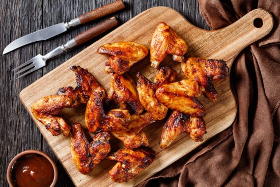 Buffalo Chicken Wings are a classic American appetizer, known for their spicy, tangy sauce and often served with celery sticks and blue cheese or ranch dressing. Originating from Buffalo, New York, these wings are perfect for gatherings, especially sports events.