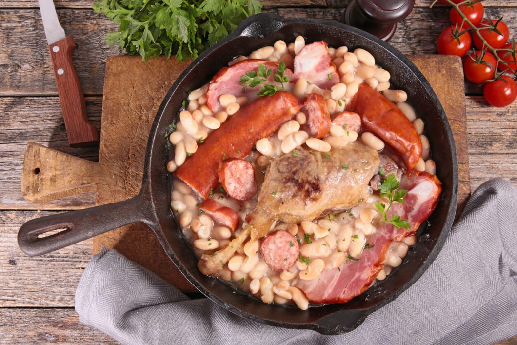 Cassoulet is a hearty and comforting French stew that originates from the Languedoc region. It's traditionally made with white beans, duck or goose confit, pork, and sausages, slowly cooked to perfection.