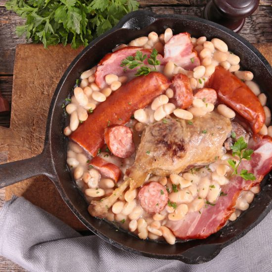 Cassoulet is a hearty and comforting French stew that originates from the Languedoc region. It's traditionally made with white beans, duck or goose confit, pork, and sausages, slowly cooked to perfection.