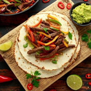 Fajitas are not only delicious but also a fun and interactive meal, perfect for gatherings where guests can enjoy customizing their own plates.