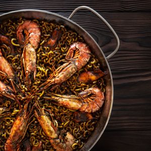 Fideuà offers a wonderful culinary experience that highlights the best of Spanish coastal cuisine with its mixture of noodles and a bounty of seafood, making it a festive and delicious meal suitable for gatherings and special occasions.