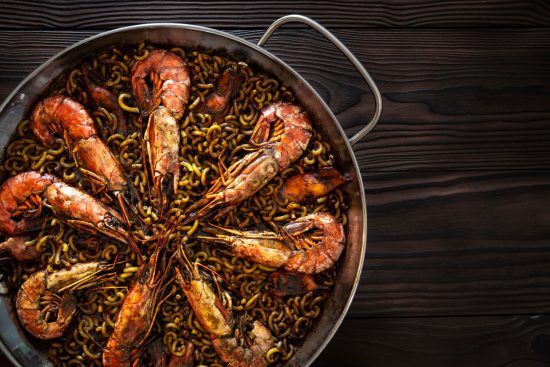 Fideuà offers a wonderful culinary experience that highlights the best of Spanish coastal cuisine with its mixture of noodles and a bounty of seafood, making it a festive and delicious meal suitable for gatherings and special occasions.