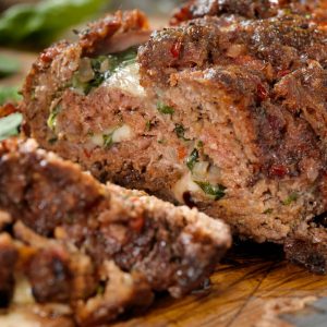 Meatloaf with deli ham, basil, and mozzarella is a delicious twist on the classic meatloaf, infusing Italian-inspired flavors into a comforting dish.