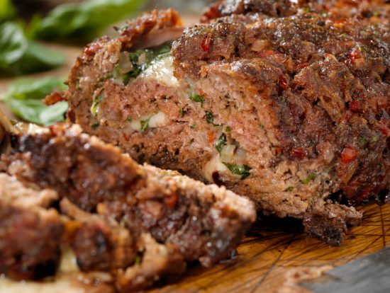 Meatloaf with deli ham, basil, and mozzarella is a delicious twist on the classic meatloaf, infusing Italian-inspired flavors into a comforting dish.