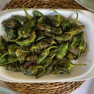 Pimientos de Padrón offer a delightful blend of flavors and textures, with the potential for a surprise spicy pepper in the mix. They're a perfect example of the simplicity and elegance of Spanish tapas.