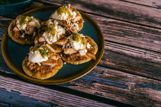 Sopes are a fun and customizable dish that can be enjoyed as an appetizer or a main course, and they are perfect for involving the whole family in the cooking process. The toppings can be mixed and matched according to personal preferences, making them a versatile choice for any meal.