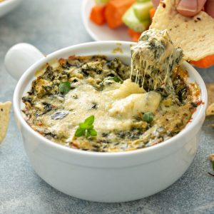 Spinach and Artichoke Dip is a creamy, cheesy, and savory dish that's a popular appetizer at parties and gatherings.