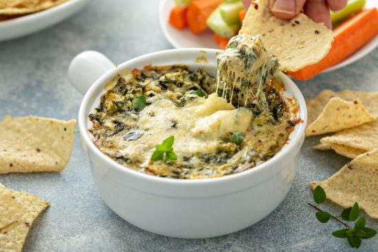 Spinach and Artichoke Dip is a creamy, cheesy, and savory dish that's a popular appetizer at parties and gatherings.