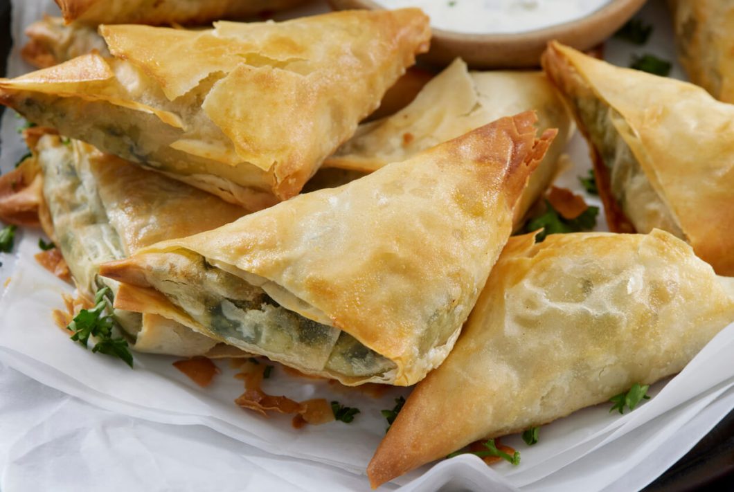 Spanakopita is a classic example of Greek culinary artistry, combining simple but flavorful ingredients into a dish that's both versatile and delicious.