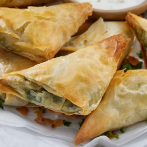 Spanakopita is a classic example of Greek culinary artistry, combining simple but flavorful ingredients into a dish that's both versatile and delicious.